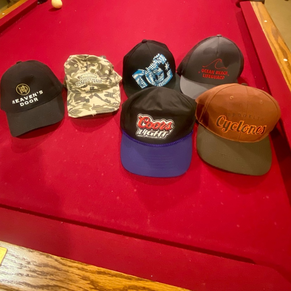 7 caps. 5 trucker style, 2 golf style. Variety.